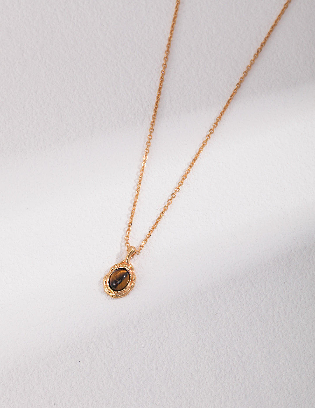 Pure silver necklace with a tiger eye stone pendant