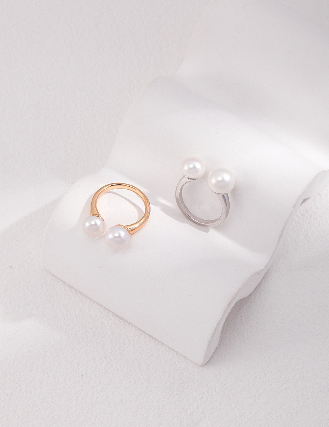 Pearl ring with an open design