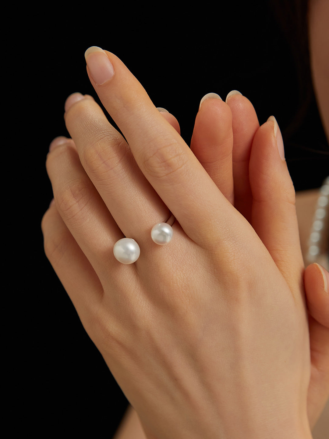 Pearl ring with an open design