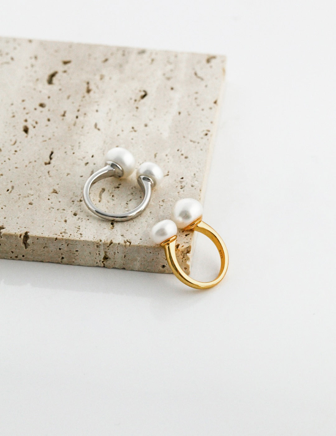 Pearl ring with an open design
