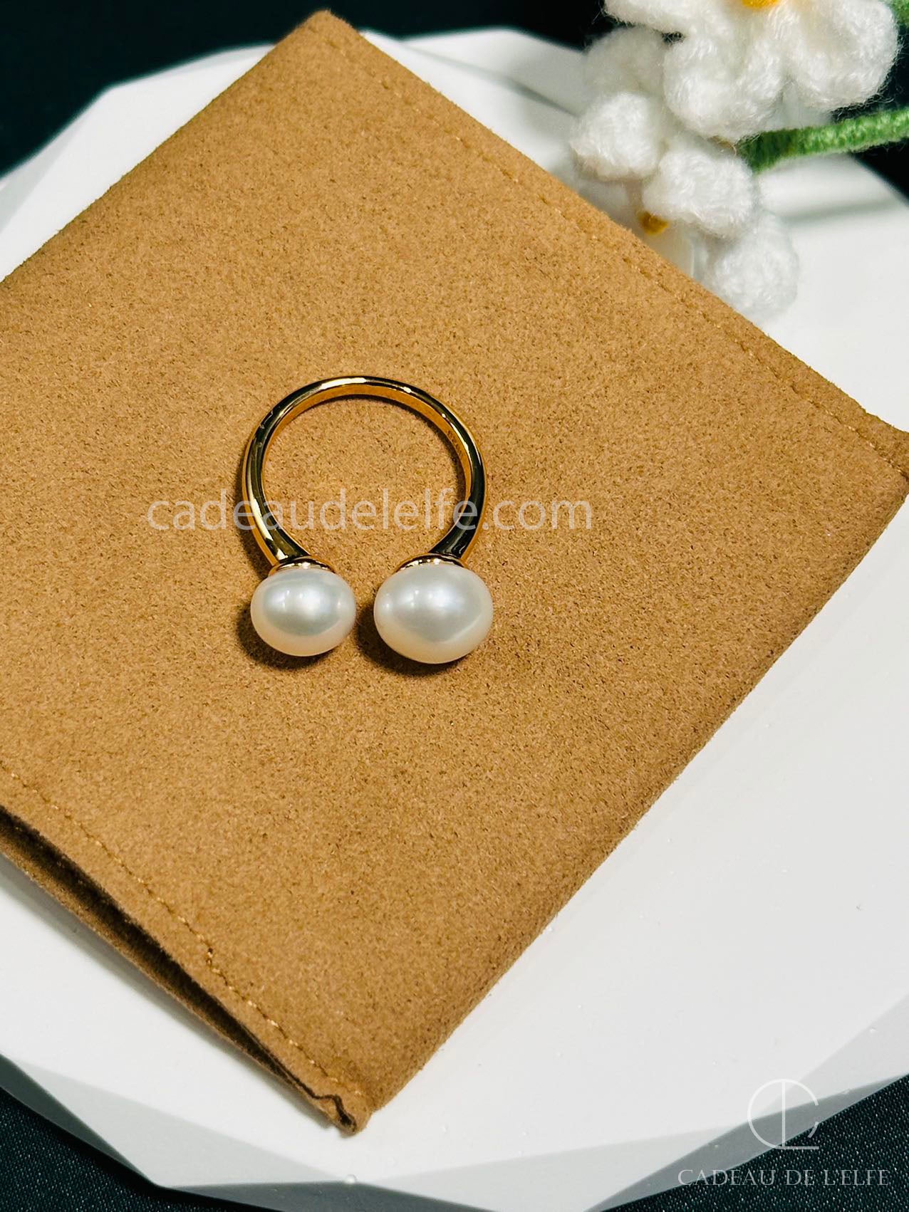 Pearl ring with an open design