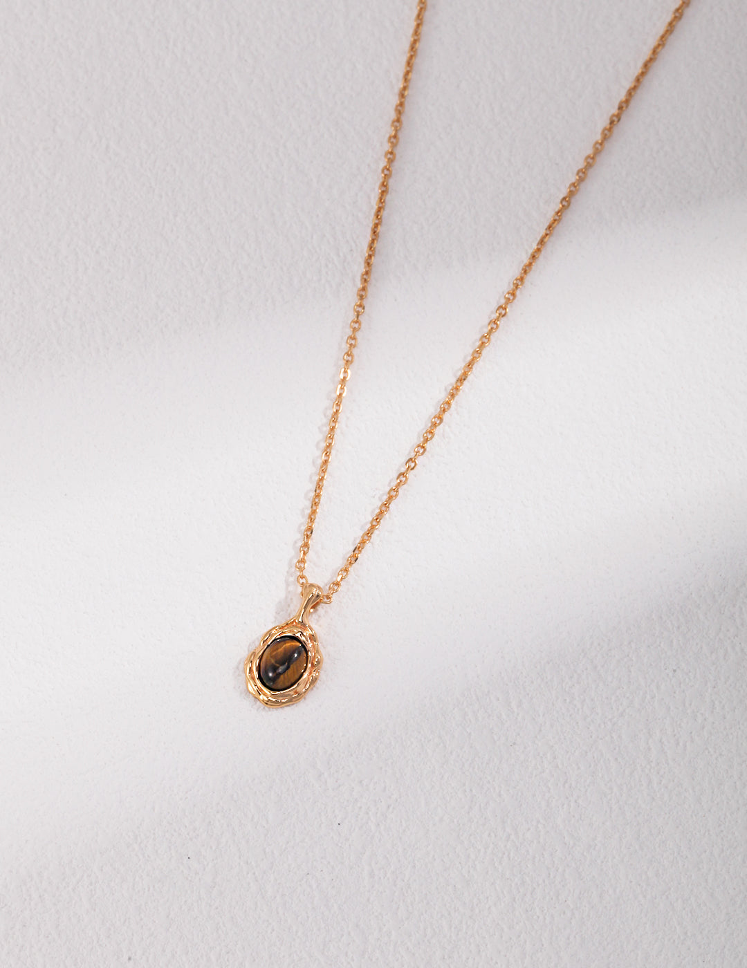 Pure silver necklace with a tiger eye stone pendant