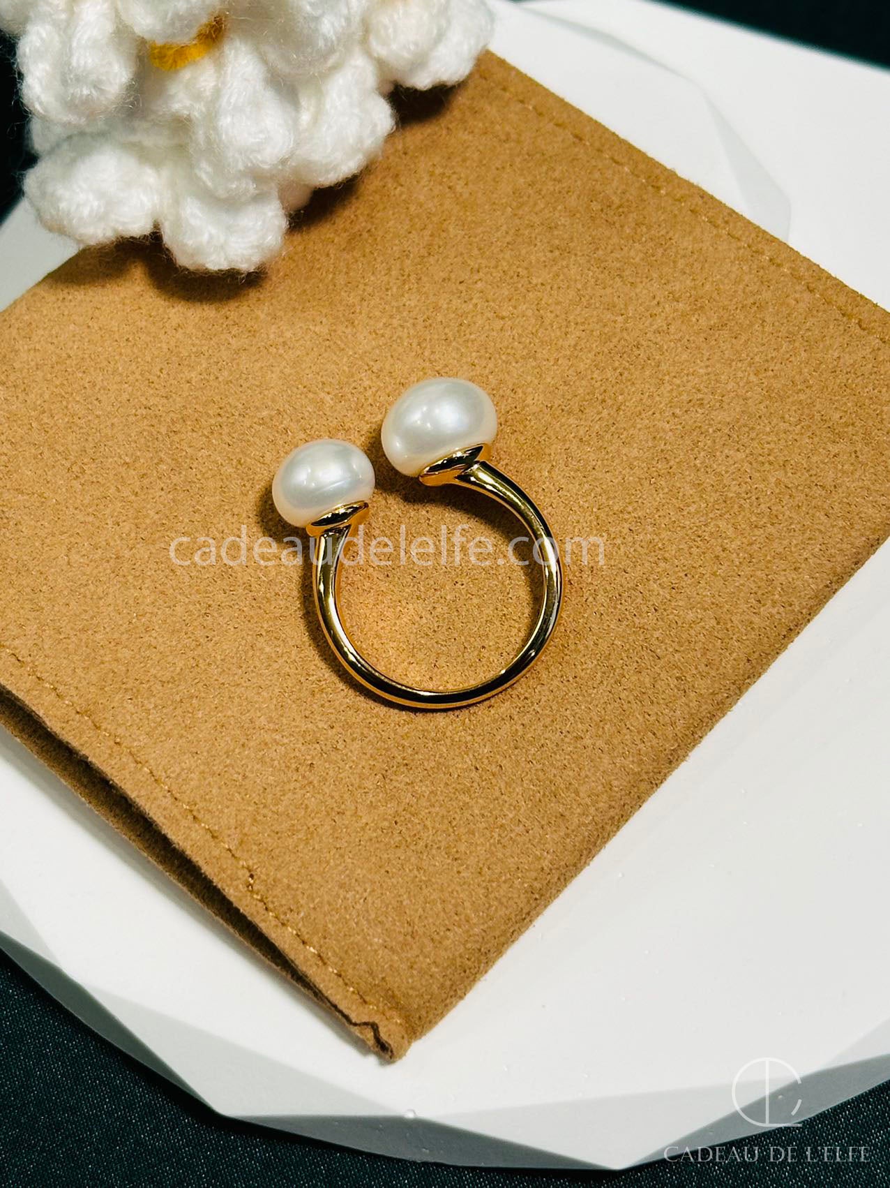 Pearl ring with an open design